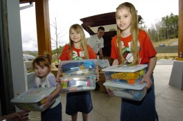 US-Volunteers-Drop-Off-Shoe-Boxes-at-Collection-Center